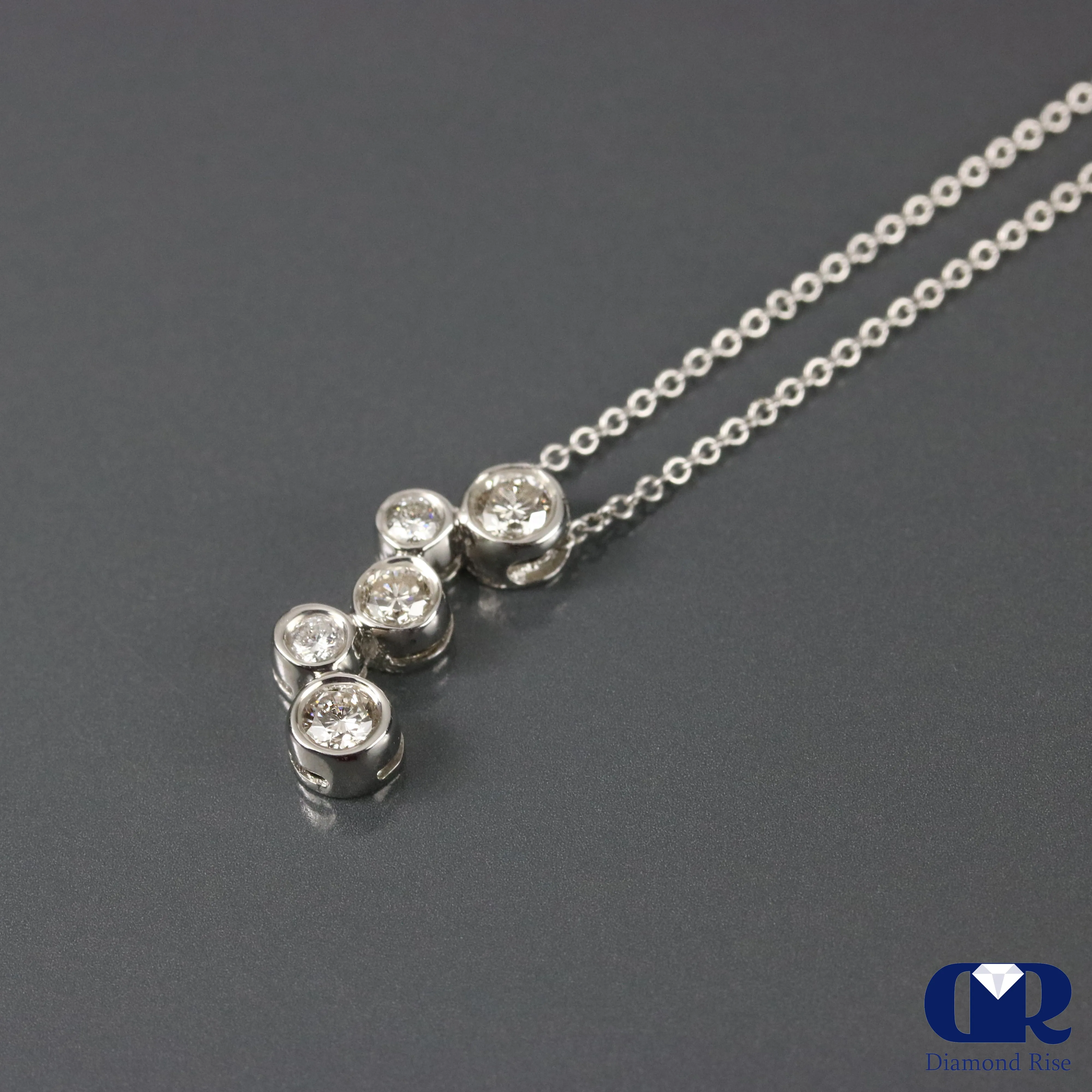 0.65 Round Cut Diamond Pendant In 14K White Gold With 16"