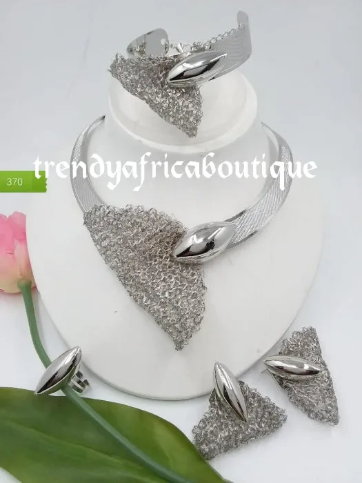 Elegant Silver set: Elegant Dubai 4pcs 18k electroplated choker necklace, matching earrings, bangle & adjustable ring. hypoallergenic plating. Sold as a set and price is for the set. As shown in display photo.